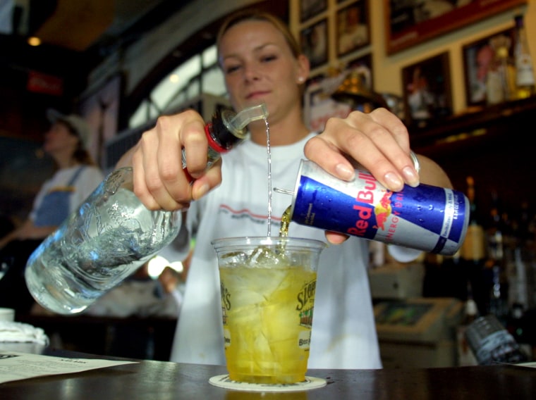 392259 02: Sloppy Joe''s Bar Tender Crystal Petersen mixes a Red Bull energy drink with vodka July 22, 2001 in Key West, FL. The popular energy drink ...