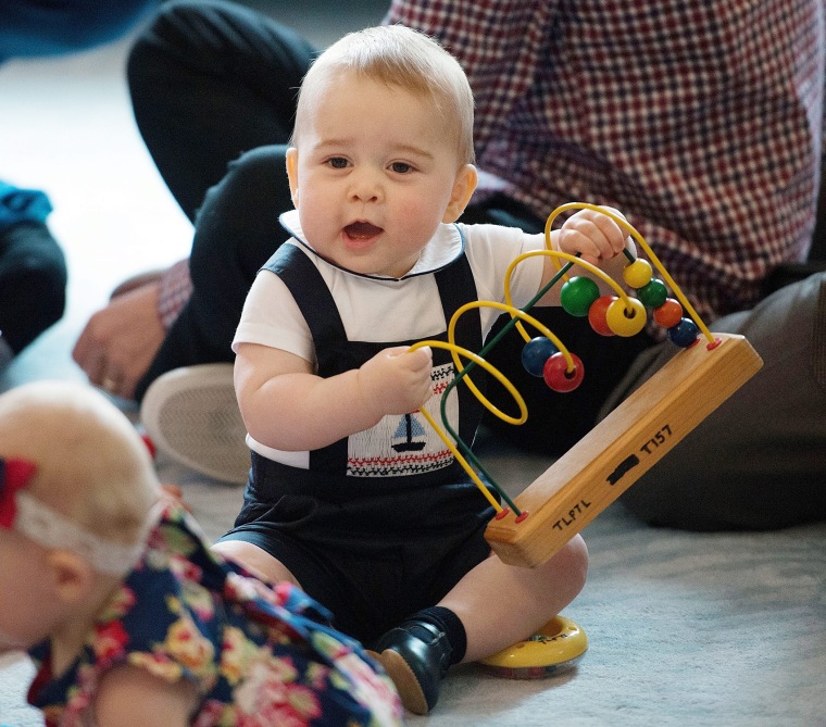 epa04315293 (FILE) A file picture dated 09 April 2014 shows Britain's Prince George playing with the toys during a Plunket nurse and parents group vis...