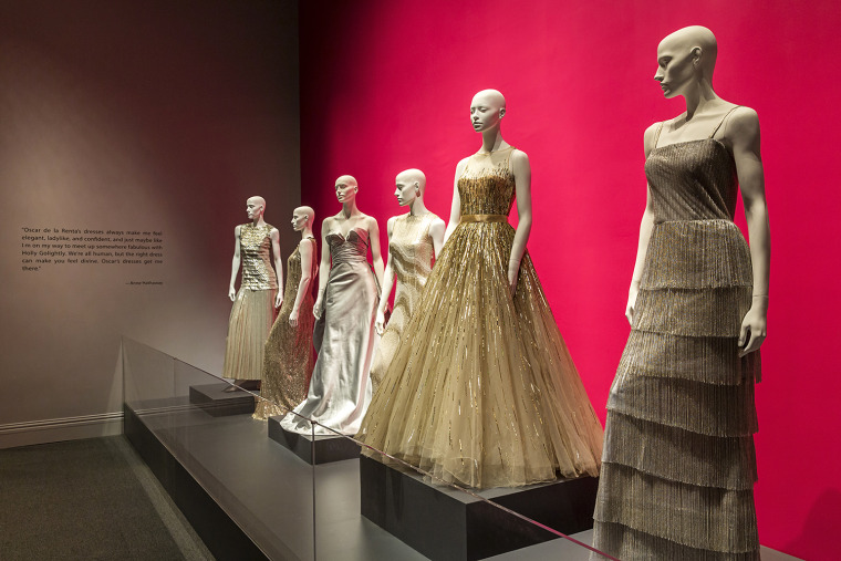 Gowns lined up at the Bush Center's Oscar de la Renta exhibit.