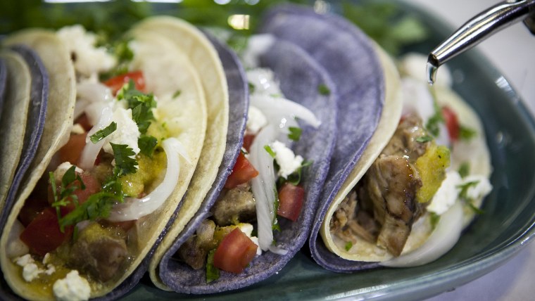 Jon Matsubara, Isaac Bancaco, Tamron Hall and Natalie Morales make pork tacos on the TODAY show in New York, on July 23, 2014.