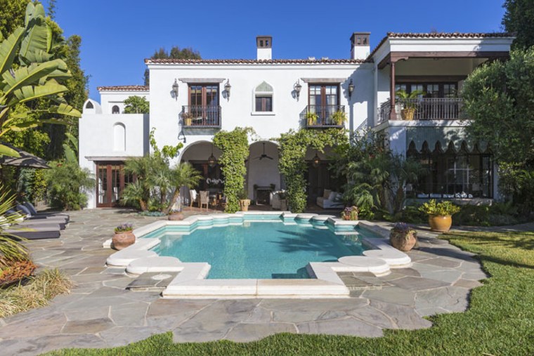The swimming pool on the $10.99 million property was modeled after a coat of arms in Spain.