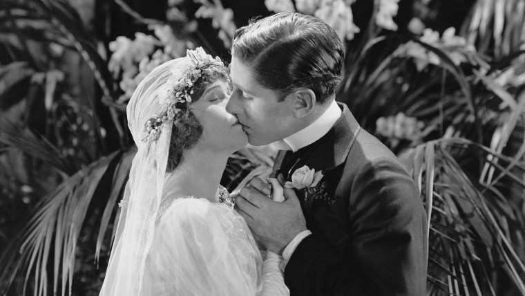 Image: Vintage photo of bride kissing groom