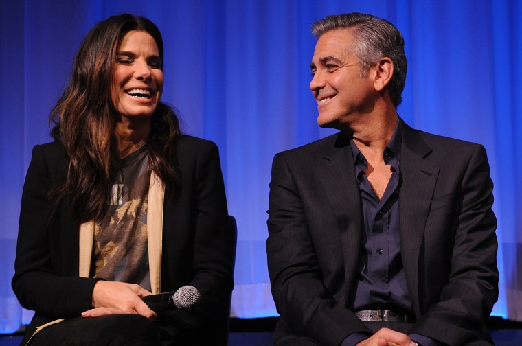 Image: Sandra Bullock and George Clooney at an official screening of \"Gravity\"