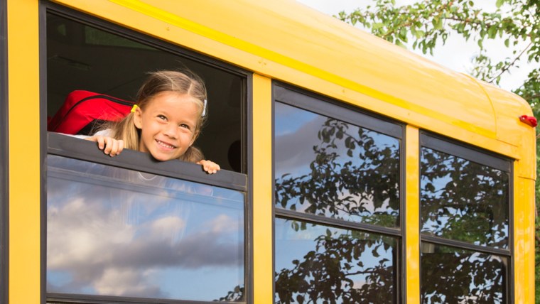 Little Schoolgirl looking through a Schoolbus Window; Shutterstock ID 110490320; PO: Today.com