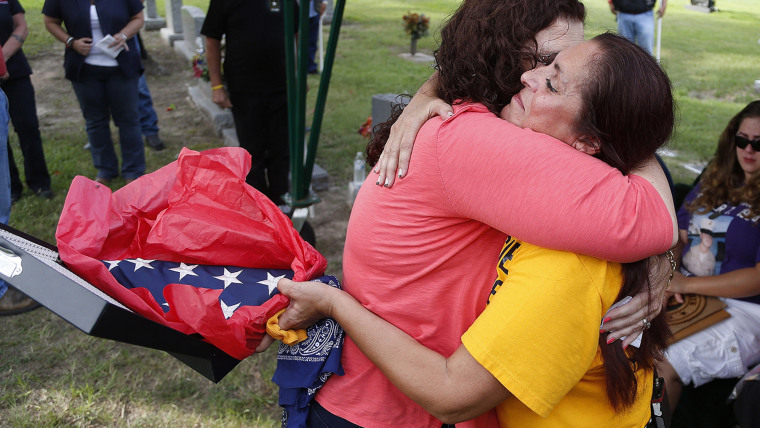 Patsy Maciel, right, the mother of Lance Cpl. Fred Maciel, who died in a helicopter in Iraq more than nine years ago, embraces Lanie Brown as she hold...