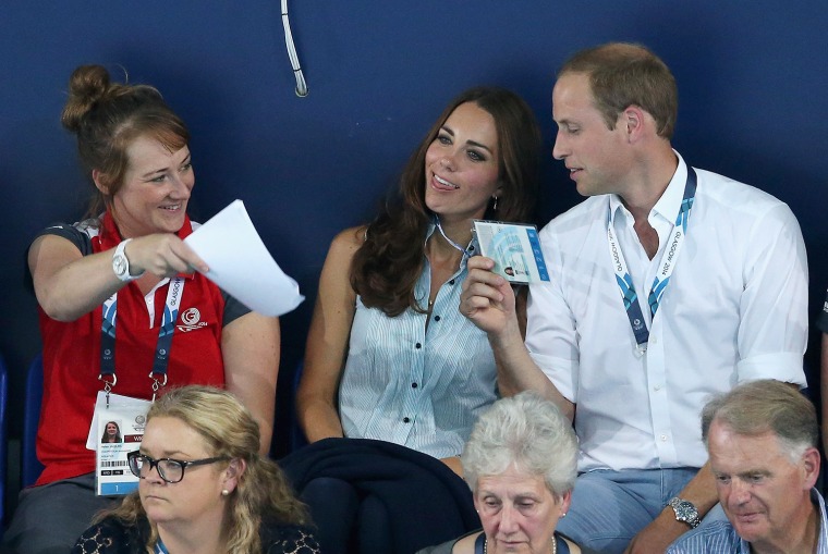 Kate got a helping hand with the heat from her husband and a games volunteer, who tried to create some breeze in the stands.