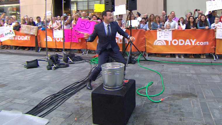 Carson and his one slowly-filled water balloon were no match for Malone and his bucket full of quickly-filled ones during a water balloon fight in Rockefeller Plaza.