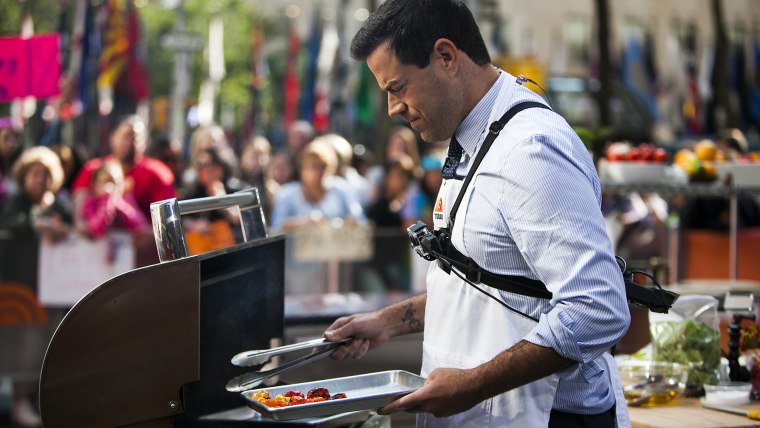 Robyn Lindars and Carson Daly make calzones and margherita pizza on the TODAY show as part of Fresh Cooks Live in New York, on July 29, 2014.