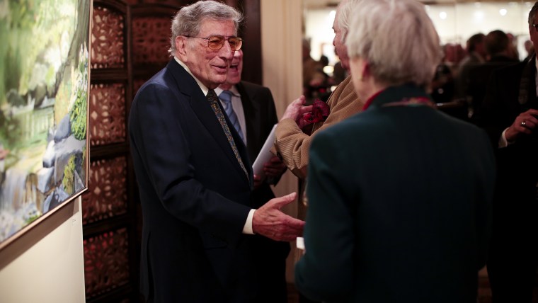 Image: Tony Bennett greets visitors to his exhibit in New York. The gallery of paintings and sculptures features work from throughout his career.