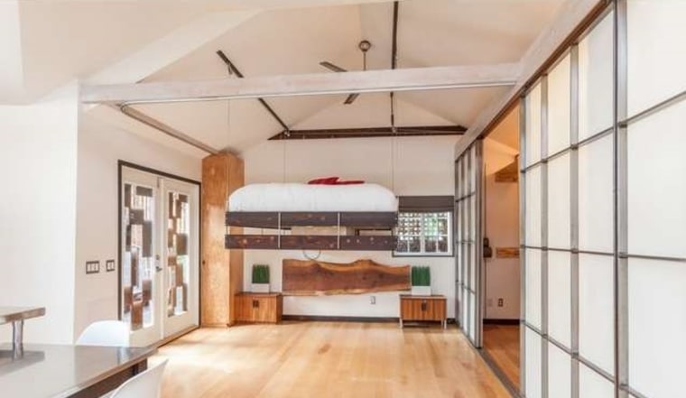 The bed in Vincent Kartheiser's tiny bungalow hangs from the ceiling with a pulley system.