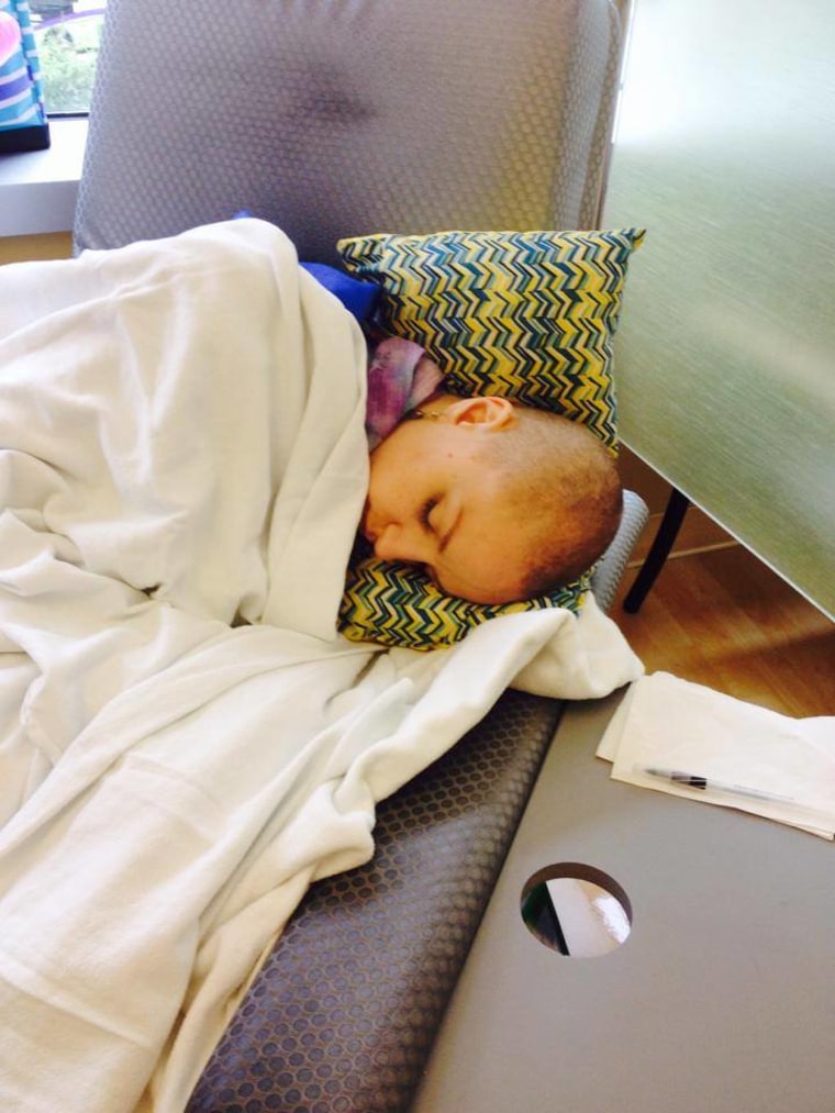 Maggie takes a nap during one of her chemo treatments.