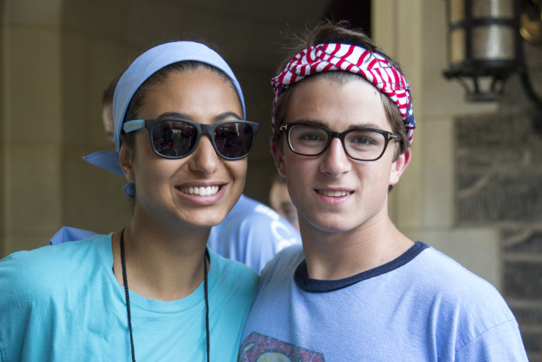 Anaele Abescat of France and John Candela of the U.S. pose for a photo before the start of the Peace Games.