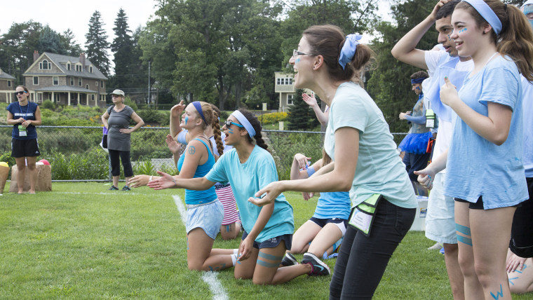 Anaele Abescat, center, cheers on her fellow Sky Blue teammates during the first competition of the Peace Games.