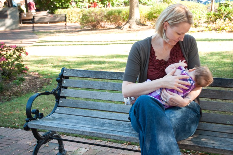 Heather Davis nurses her daughter.