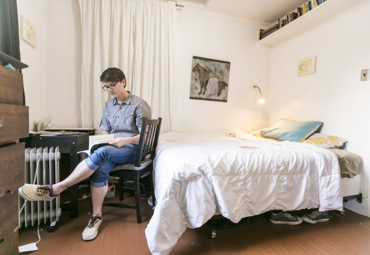 Image: Airbnb guest Megan Walsh, a Chicago writer on a summer internship, reads in her room at the Echo Park home of artist Jonathan Entler on May 19 in Los Angeles.