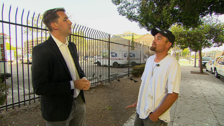 Ernesto Pulido speaks to TODAY's Joe Fryer near the tree he trimmed.