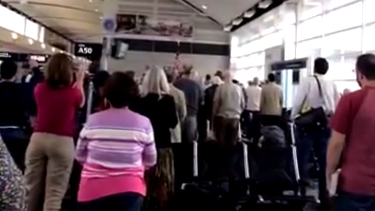 A Delta gate agent sang the national anthem to WWII veterans at DTW airport.