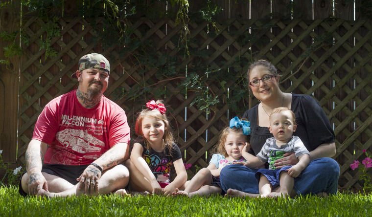 Image: Lance Stewart with his wife Jamie, daughters Abbi, 5, Brooklyn, 3 and son Connor, 1, at their League City, Texas, home.