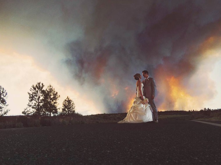 Photographer Josh Newton captured these images of April Hartley and Michael Wolber with a blazing wildfire as their backdrop.