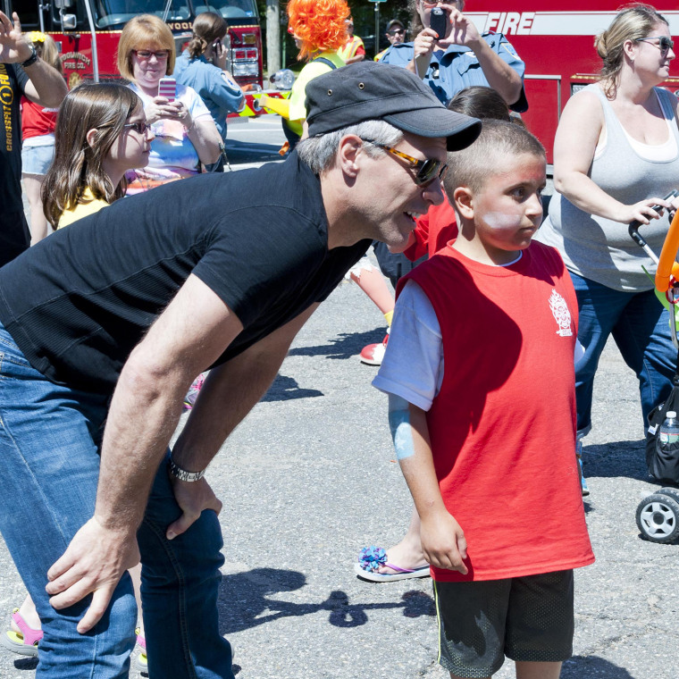 Jon Bon Jovi visits with 10-year-old Mario Carpino. Bon Jovi made a surprise visit to Carpino's cancer fundraiser in New Jersey last Saturday.