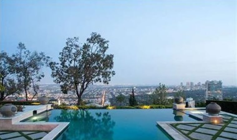 The property includes a pool and patio with L.A. views.