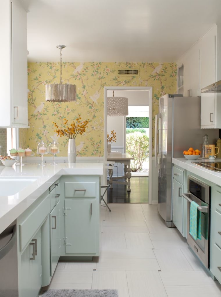 After: Painted cabinets and new countertops completely change the feel of the room.