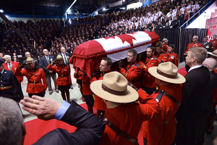 The casket of Const. Douglas James Larche, is carried in for the RCMP regimental funeral on  Tuesday, June 10, 2014 in Moncton, New Brunswick, Canada....