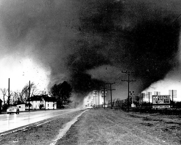 Twin tornado funnel clouds sweep along U.S. 33 near Dunlap, In. on april 11, 1965.The Palm Sunday disaster that struck the Midwest that day injured at...