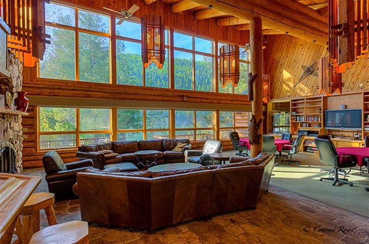 The log-cabin style retreat features 11 guest suites with private baths and a great room large enough for 30 guests.