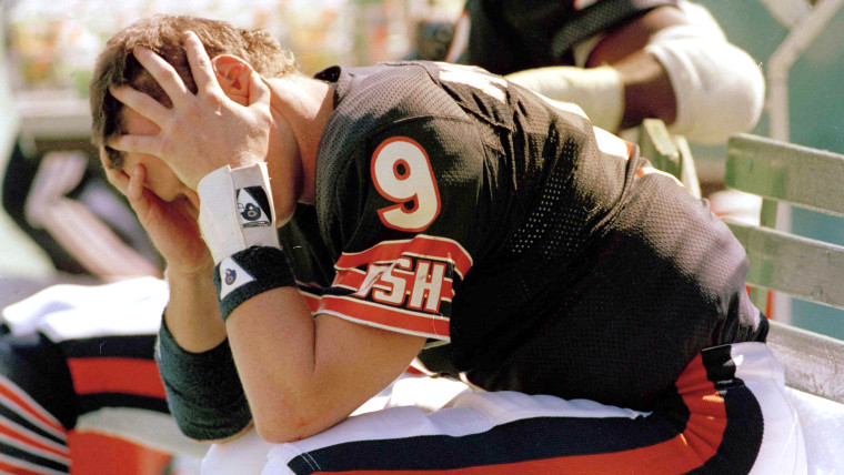 FILE - In this Sept. 15, 1985, file photo, Chicago Bears quarterback Jim McMahon messages his head and neck after an NFL football game against the New...