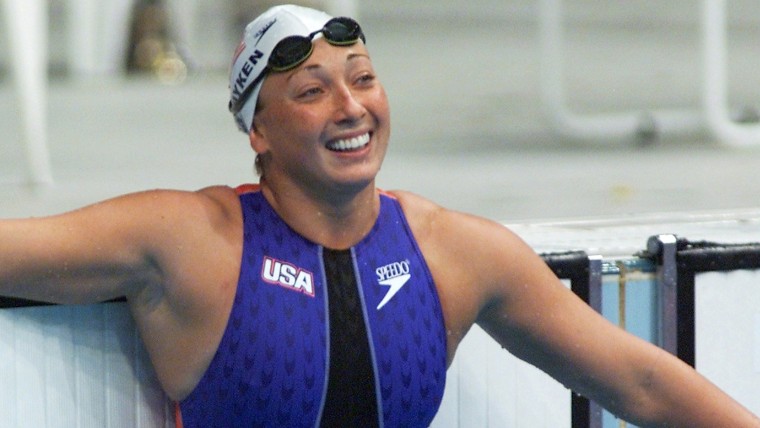 (FILES) In this file photo dated September 22, 2000 shows US swimmer Amy Van Dyken watching the time board after her 50m freestyle heat at Sydney Inte...