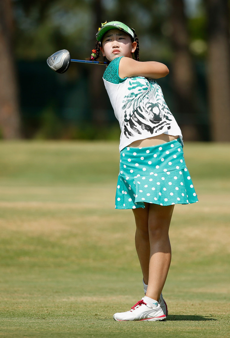 JUNE 17:  Eleven-year old Amateur Lucy Li of the United States hits a shot during a practice round prior to the start of the 69th U.S....