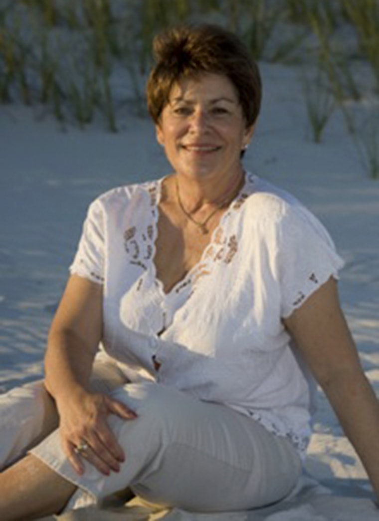 Diane, Lisa's oncology patient, sits on the beach.