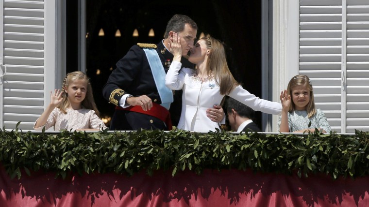 Image: Queen Letizia kisses her newly crowned husband King Felipe VI