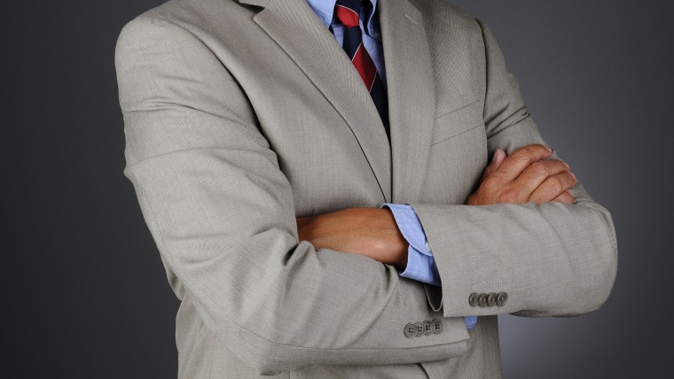 portrait-of-a-businessman-standing-with-his-arms-crossed-poster