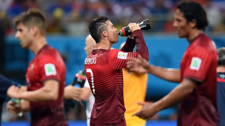 Portugal's Cristiano Ronaldo takes a historic water break along with his teammates during a 2-2 tie with the United States in the World Cup on Sunday.