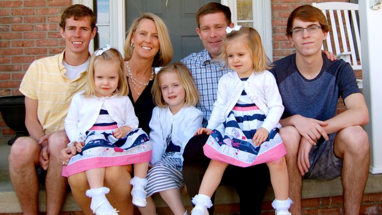 Carolyn and Sean Savage with their five children... soon to be six. After years of struggling with infertlity -- and giving birth to another couple's child after an IVF clinic mistake -- this is one (happy) surprise she never expected.