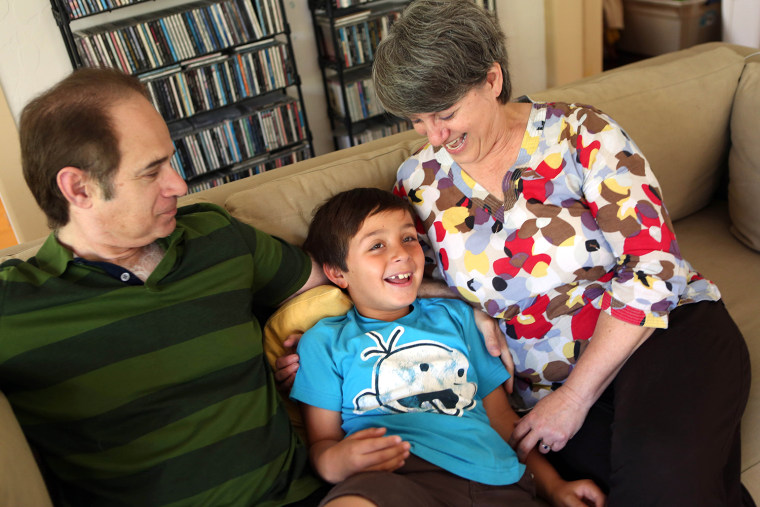 Kerry and Jed Silverstrom with their eight-year old adopted son Gus, in their home in Los Angeles, June 22, 2014.