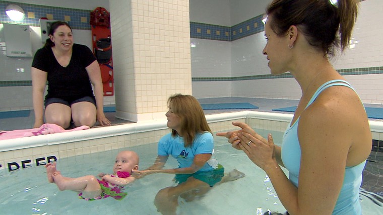 JoAnn Barnett teaches 7-month-old Emma as her mom looks on.