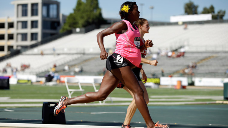 A pregnant Alysia Montano runs in the opening round of the women's 800 meter run at the USATF Outdoor Championships in Sacramento, California.