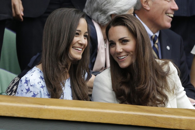 Kate, right, and Pippa chat at last year's Wimbledon tournament.