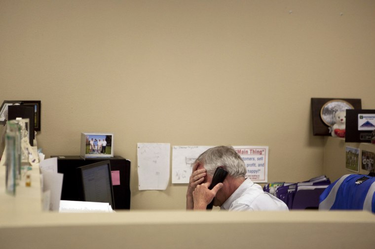 In this Feb. 15, 2012 photo, Steve Wyard, 61, a regional sales director of All Valley Washer Service, talks on the phone in his office in the Van Nuys...