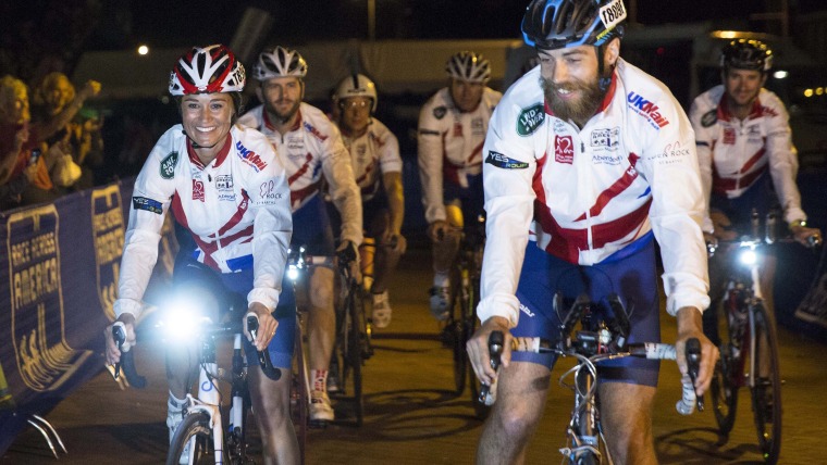 British socialite Pippa Middleton (L) and her brother James Middleton (R) at the end of their Race Across America bike race in Annapolis, Maryland, U...