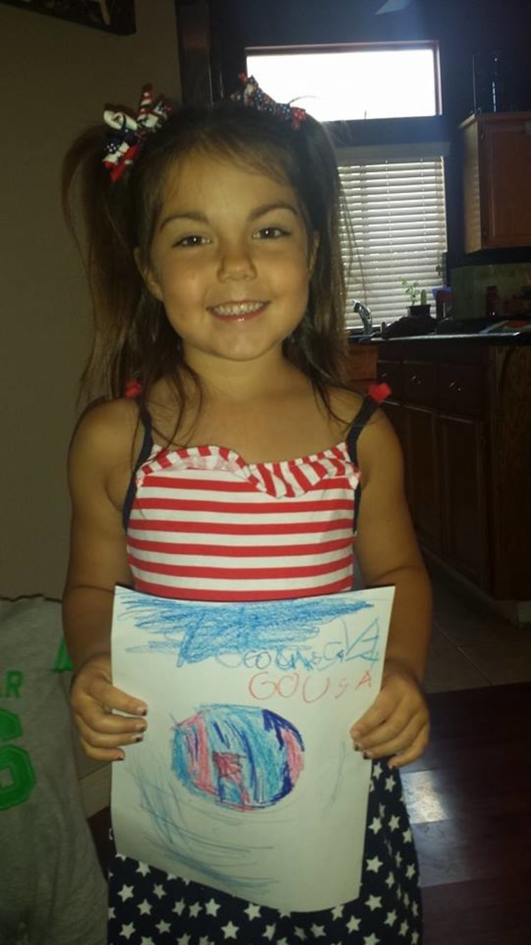 This artistic little fan made her own \"Go USA\" sign.