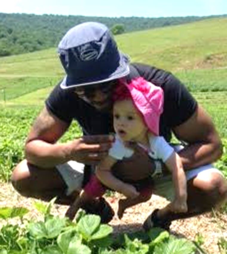 Brian Fondriest and daughter Carmela enjoying some quality time munching on some strawberries.