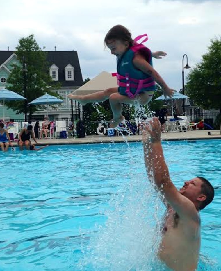 Jay Hunyor giving his daughter Natalie some airtime at the pool.
