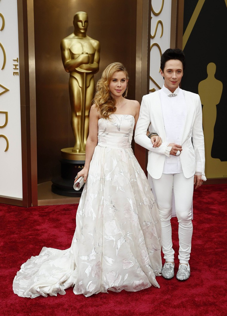 Tara Lipinski and Johnny Weir were color coordinated in white.LUCAS. 