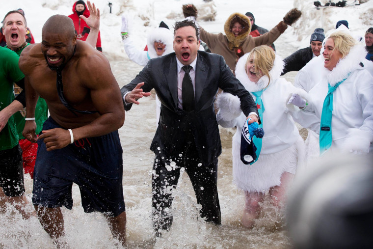 \"The Tonight Show\" host Jimmy Fallon, center, exits the water during the Chicago Polar Plunge, Sunday, March 2, 2014, in Chicago. Fallon joined Chicago Mayor Rahm Emanuel in the event.
