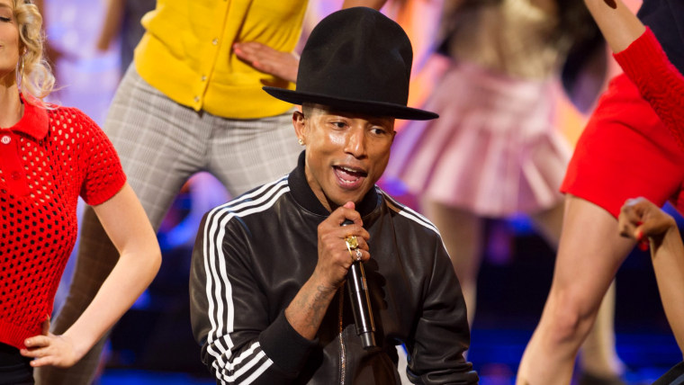 epa04107622 A handout picture provided by the Academy of Motion Picture Arts and Science (AMPAS) on 03 March 2014 shows US singer Pharrell Williams pe...
