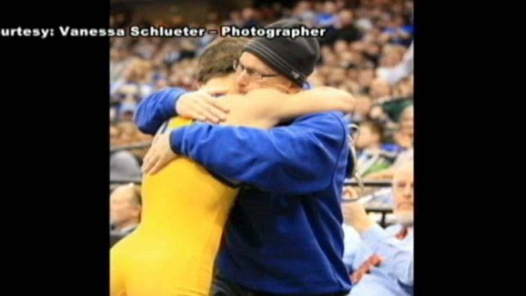 Michael Albertville High School sophomore Mitchell McKee shared an emotional hug with his father, who is battling terminal cancer, after winning the Minnesota state wrestling title at 120 pounds.